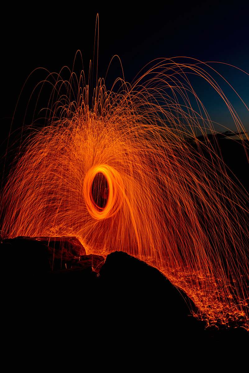 wading river beach person taking photo of round steel wool wading river